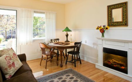Enjoy Garden Views From This Upscale B Lodging In Hudson Valley Ny Beige And White Room With Wood Floors Gl Door Window Fireplace